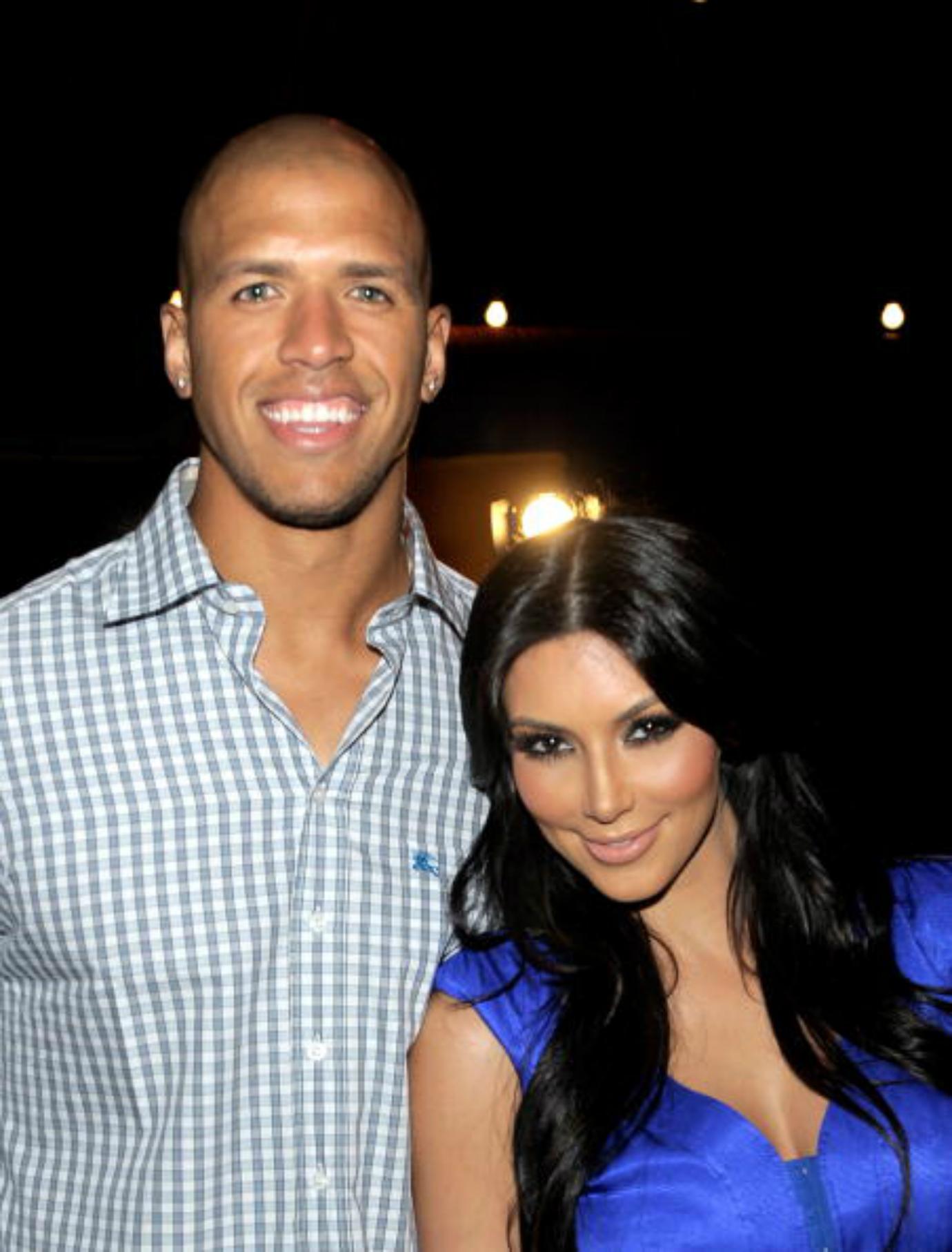 Miles Austin and Kim Kardashian smile for the camera.