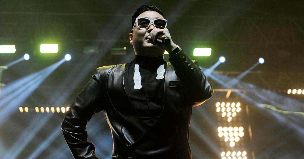 A photo of Psy performing on stage.