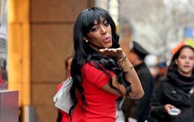 Porsha Williams spotted in a plunging red dress while blowing kisses to the paparazzi in New York City