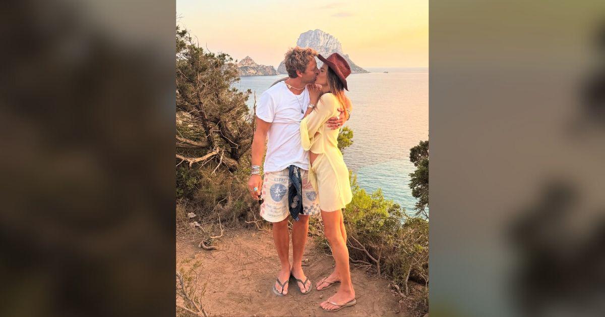 image of Alessandra Ambrosio and Buck Palmer kissed by the water.