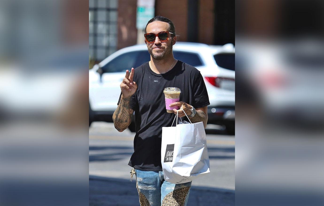 EXCLUSIVE: Pete Wentz looks stylish while getting a drink and food to go