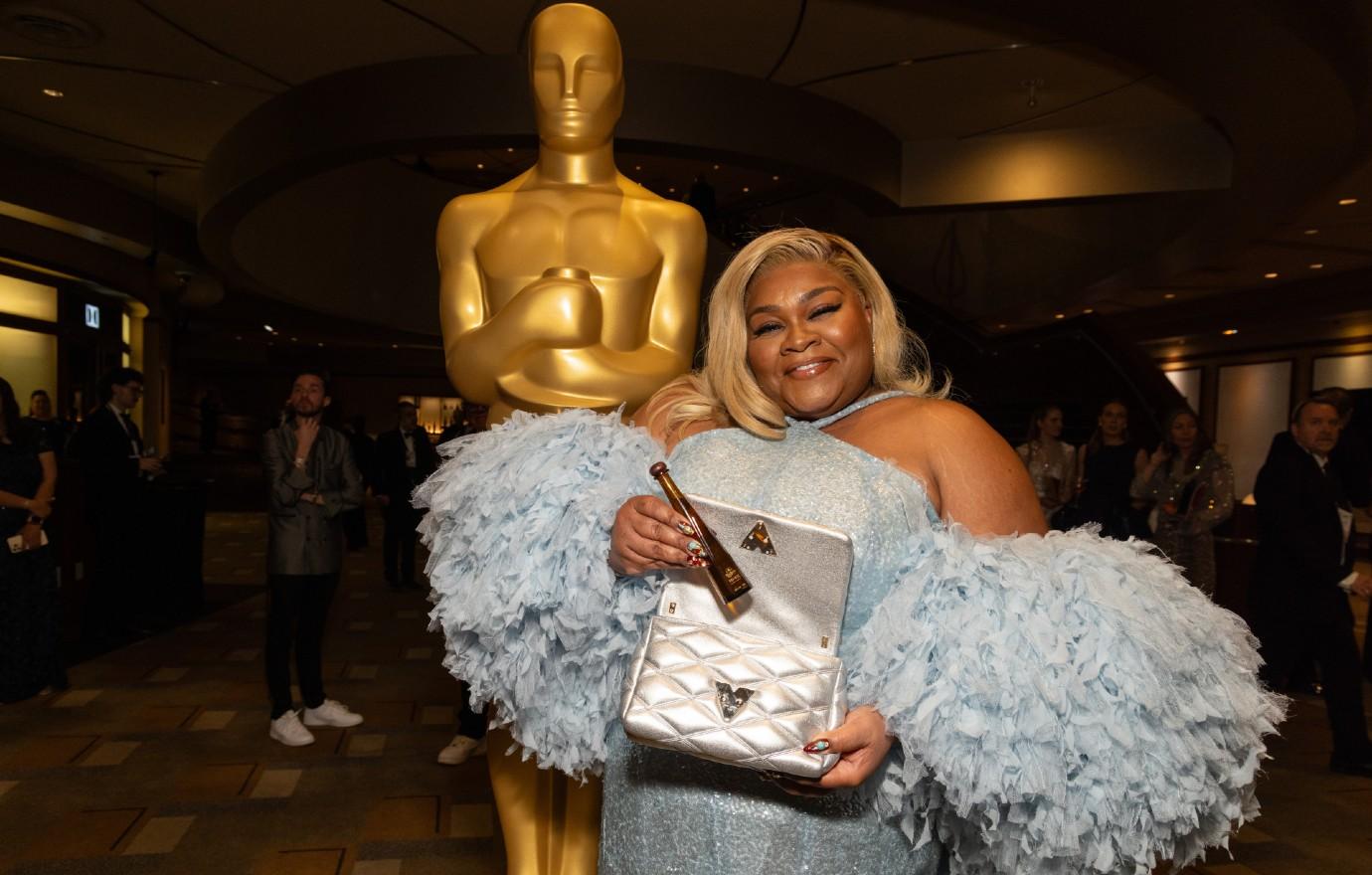 davine joy randolph gets in the celebratory spirit with tequila don julio  as she walks the red carpet for the th annual oscars ceremony