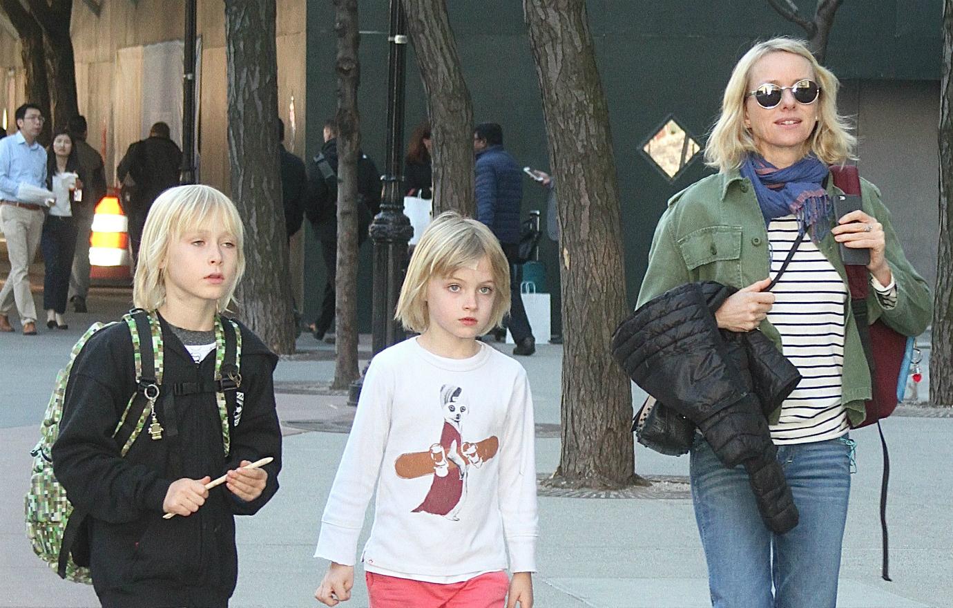 Naomi Watts walks with her two kids.