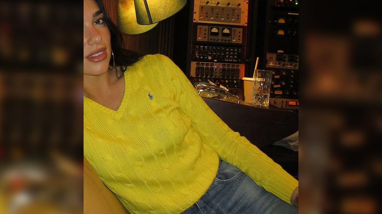 Image of Dua Lipa also posed inside of a recording studio during the carousel of photos. 