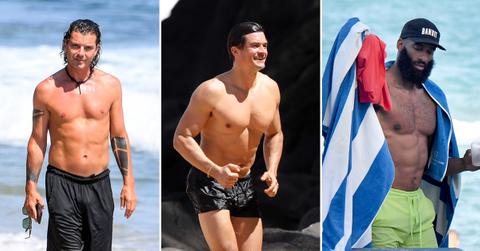 shirtless men on the beach