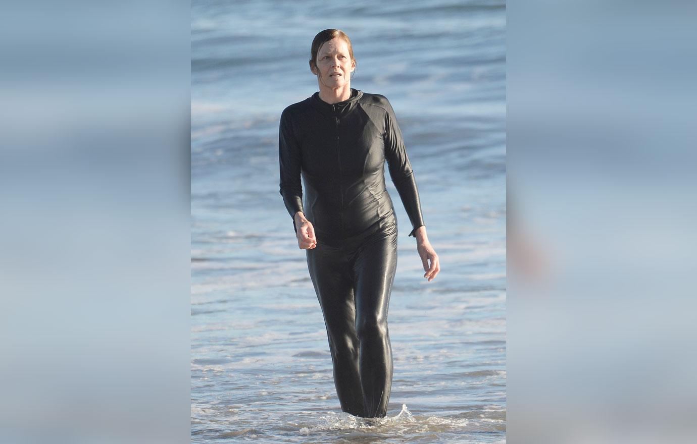 Sigourney Weaver And Husband Jim Simpson Hold Hands After Swim Photos