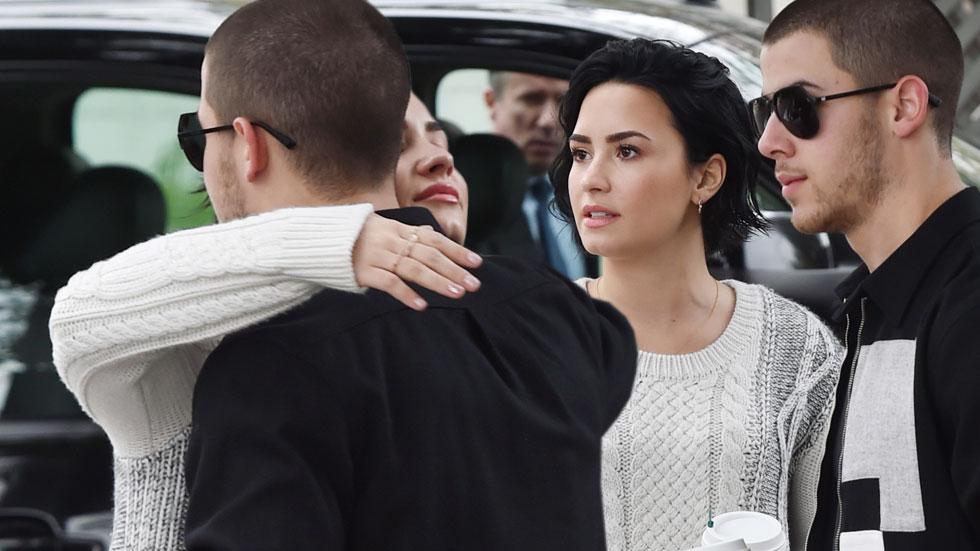 demi lovato nick jonas hugging while getting coffee