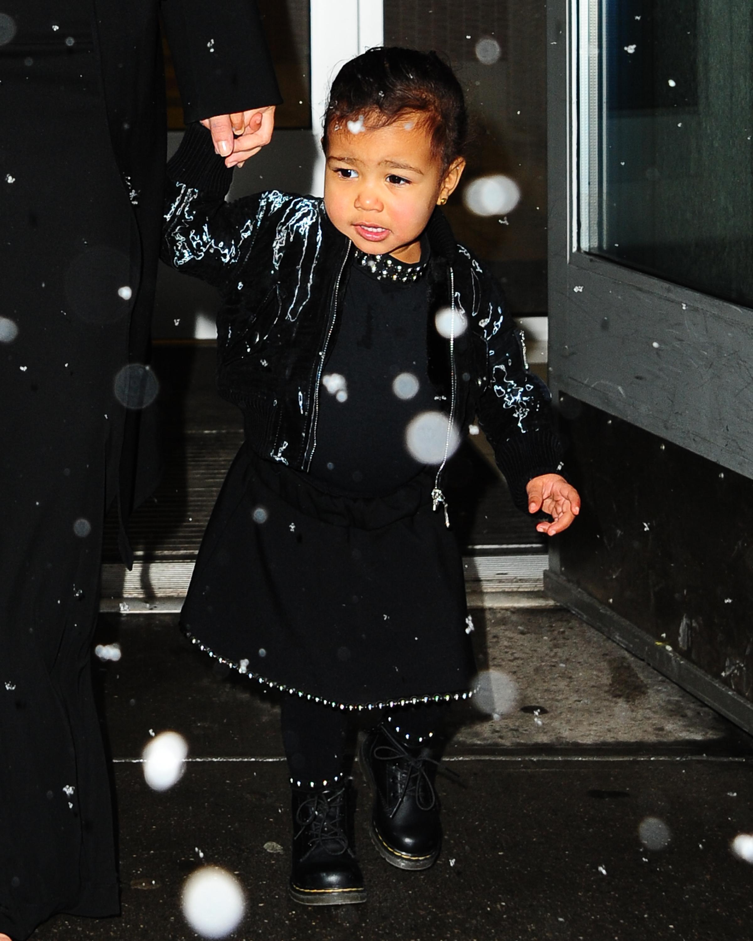 Kanye West, Kim Kardashian and North West enjoy the snow on their way to a fashion show in New York City ***NO DAILY MAIL SALES***