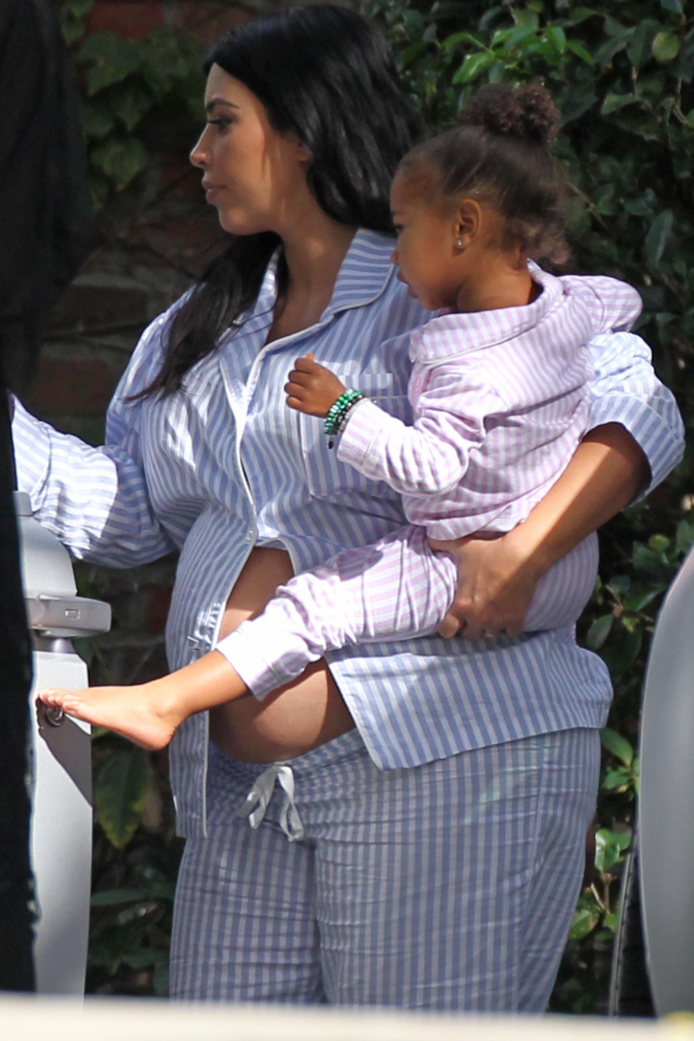 Kim Kardashian Flashes Bare Baby Bump While Leaving Baby Shower in Beverly Hills