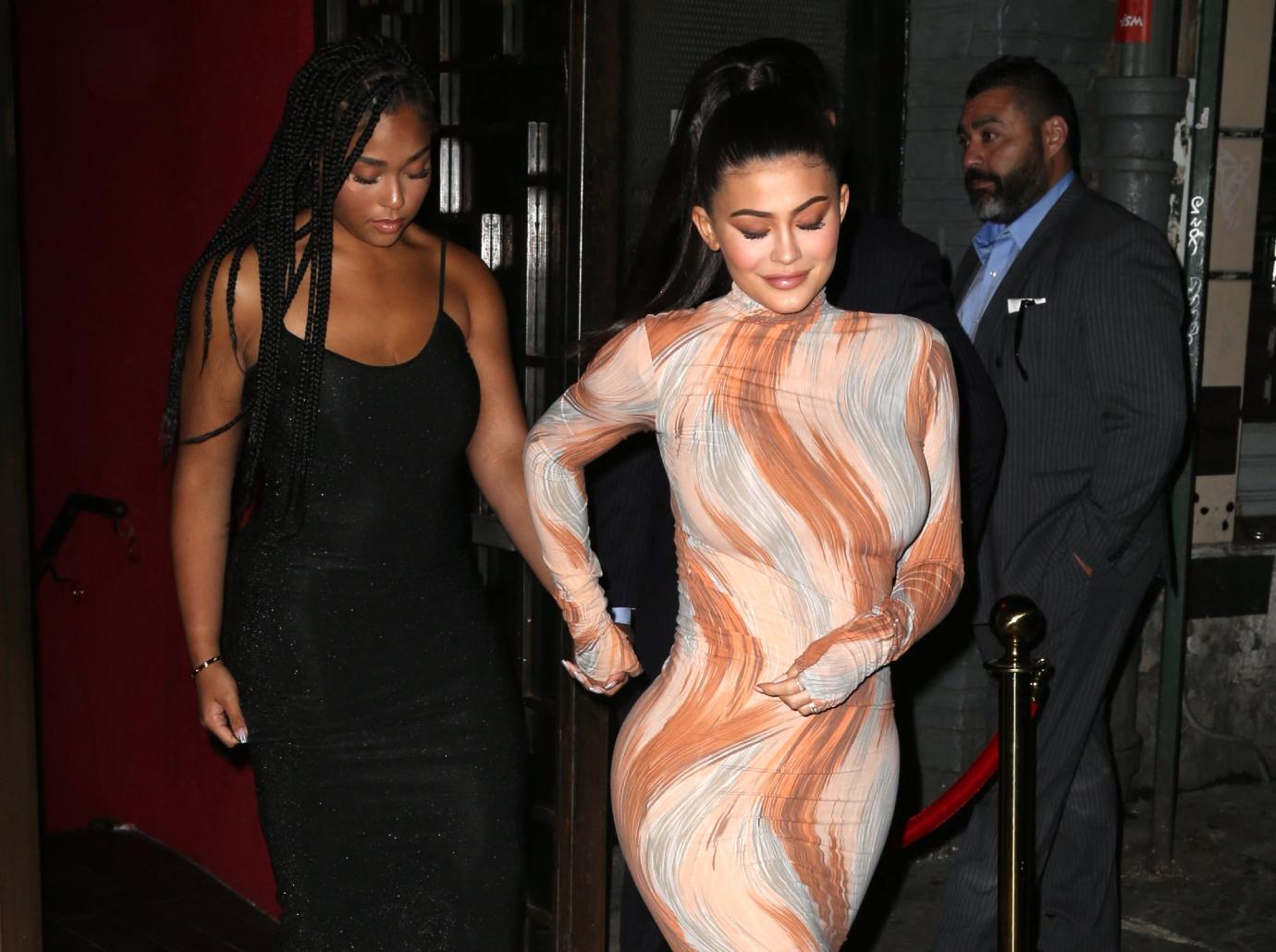 Jordyn Woods flaunts curves in tight dress after being accused of