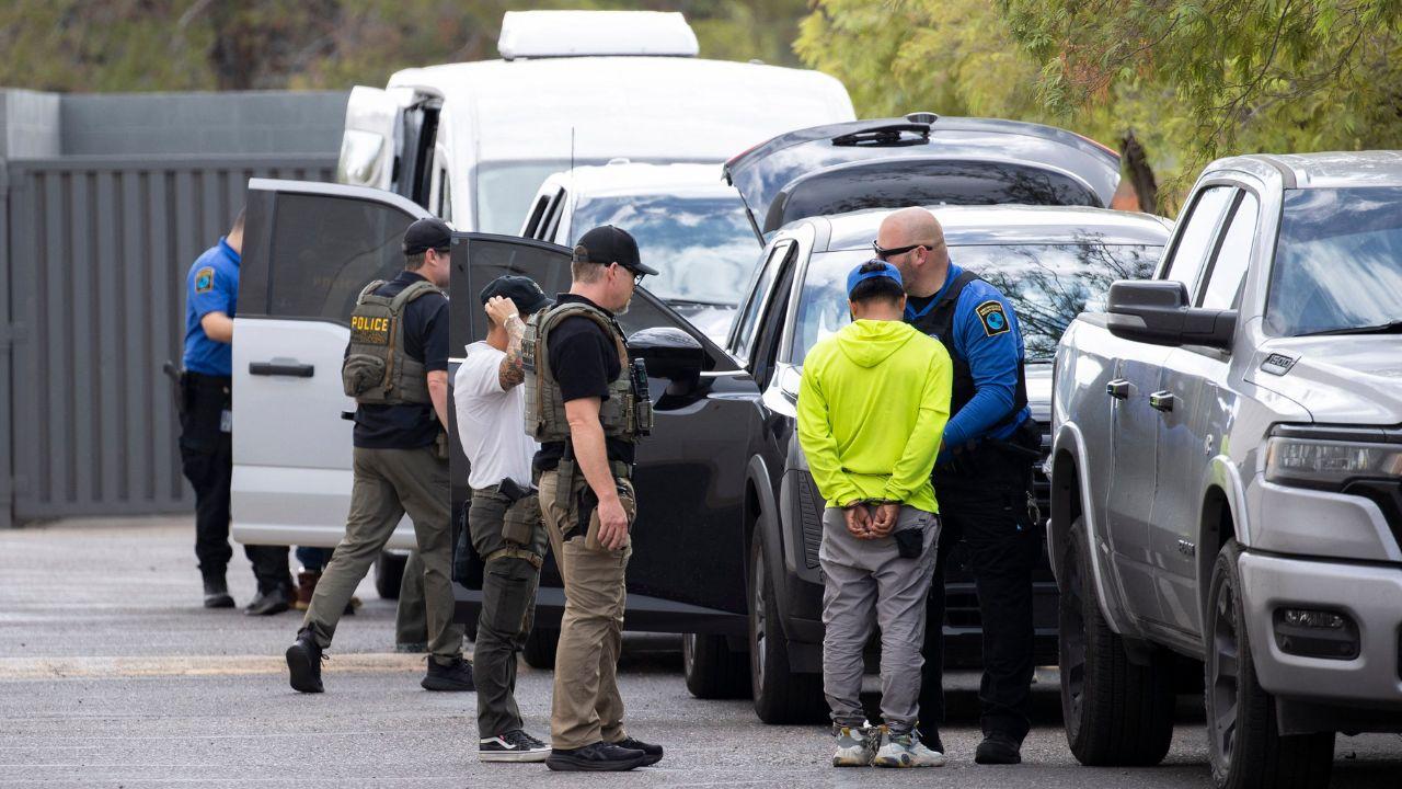 Image of seven former detainees accuse ICE of withholding personal belongings months after their release.