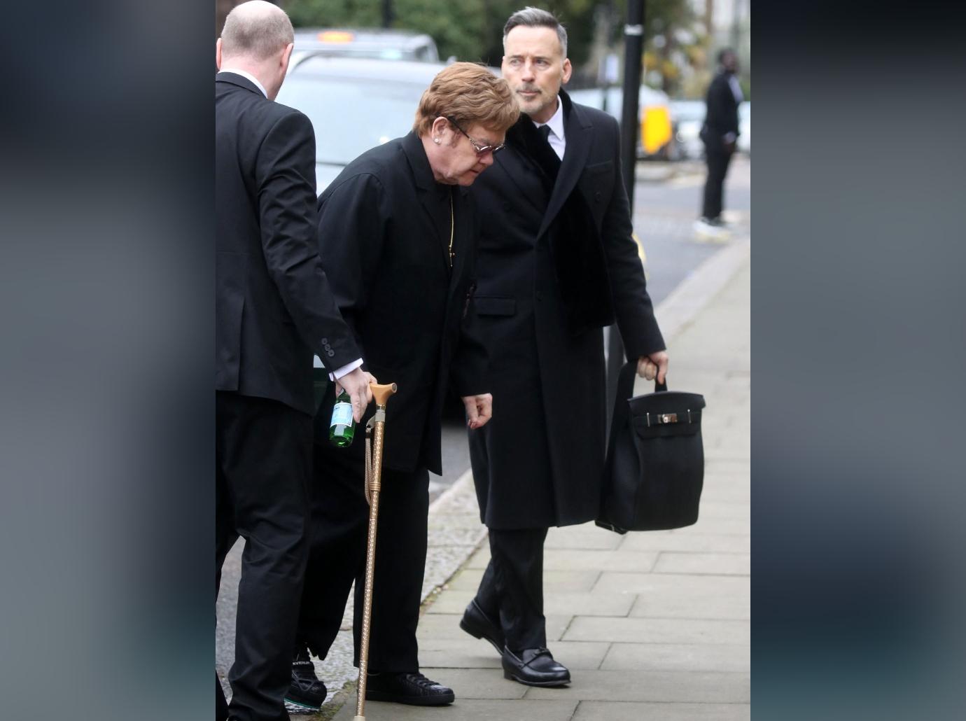 elton john sparks health concerns cane injured foot photos