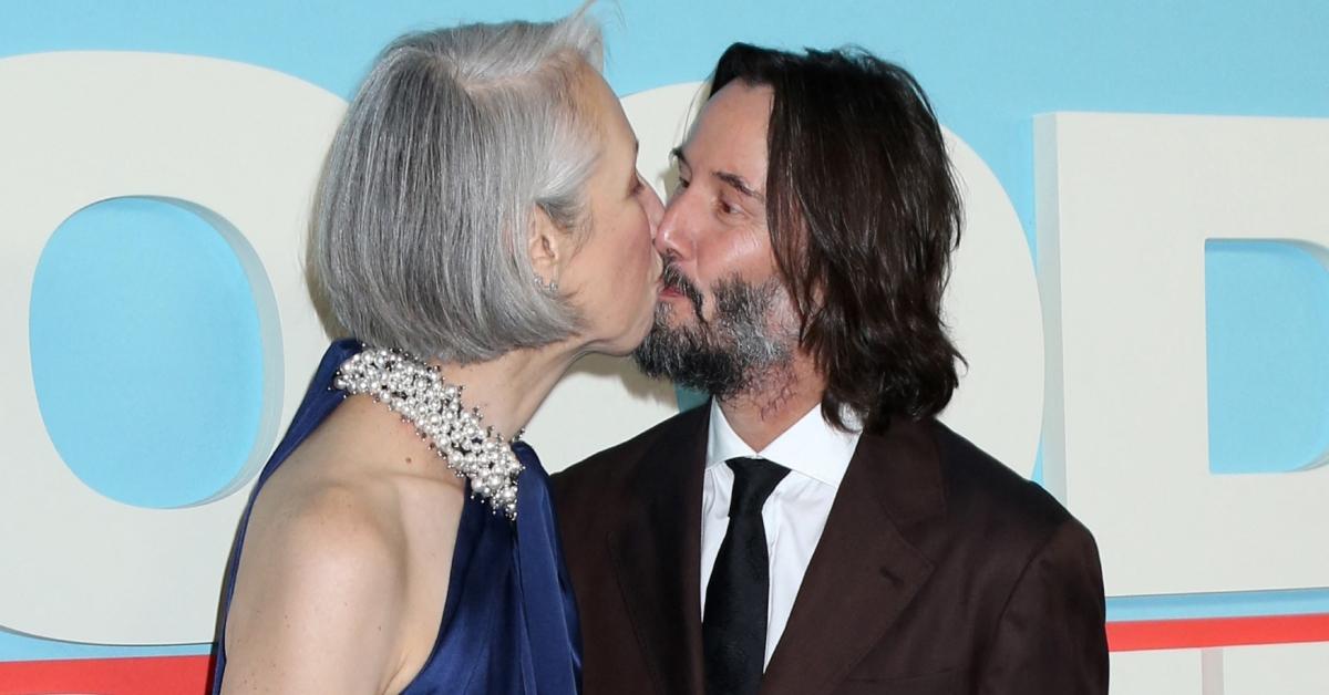 Photo of The longtime lovebirds packed on the PDA at Reeves' movie premiere.
