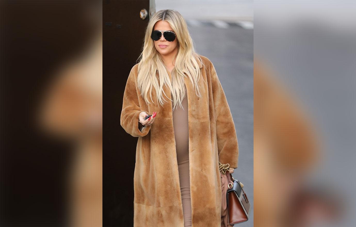 A pregnant Khloe Kardashian changes into Yeezys at the studio to be more comfortable