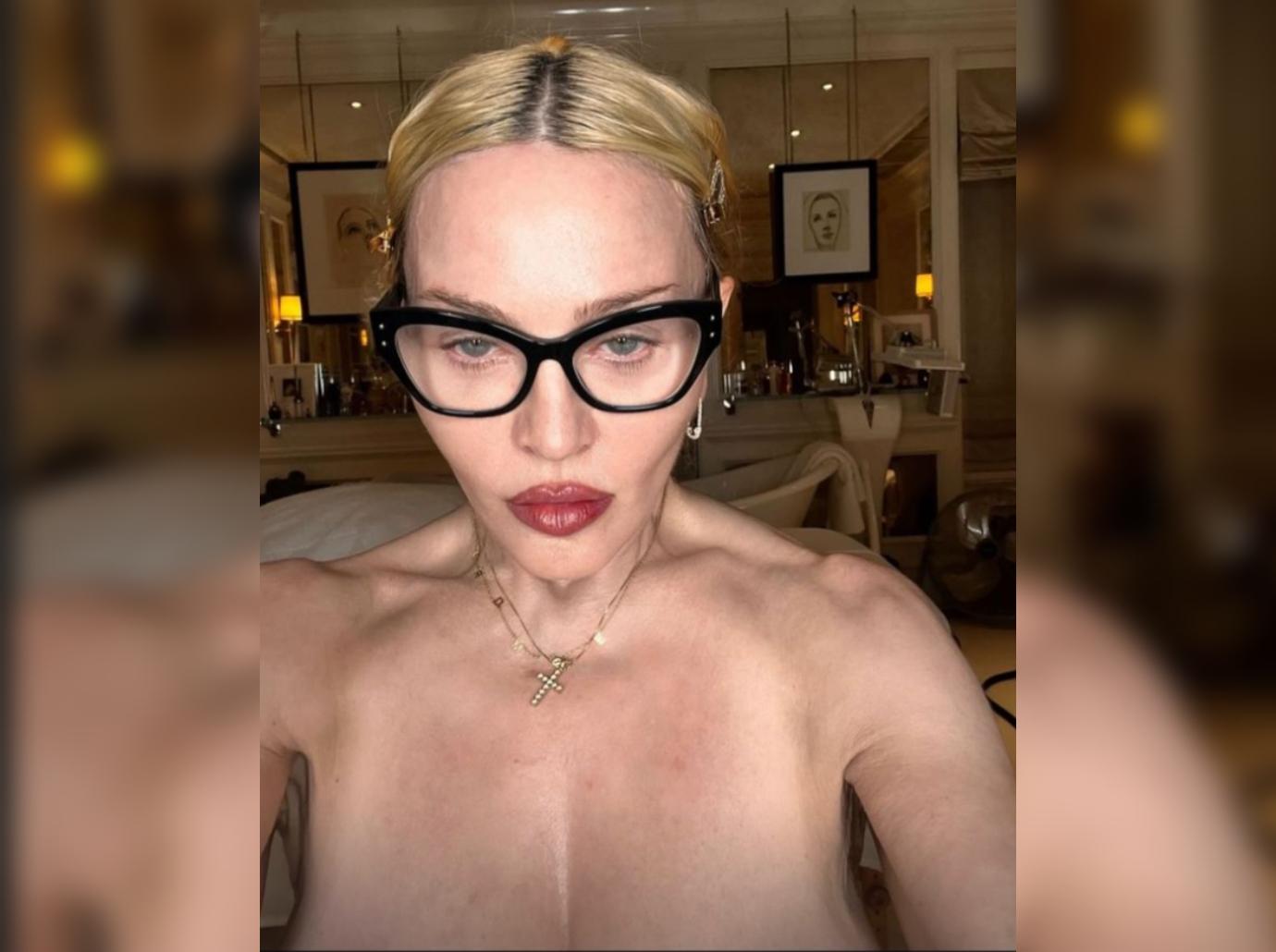 madonna posts topless photos eating haters attention