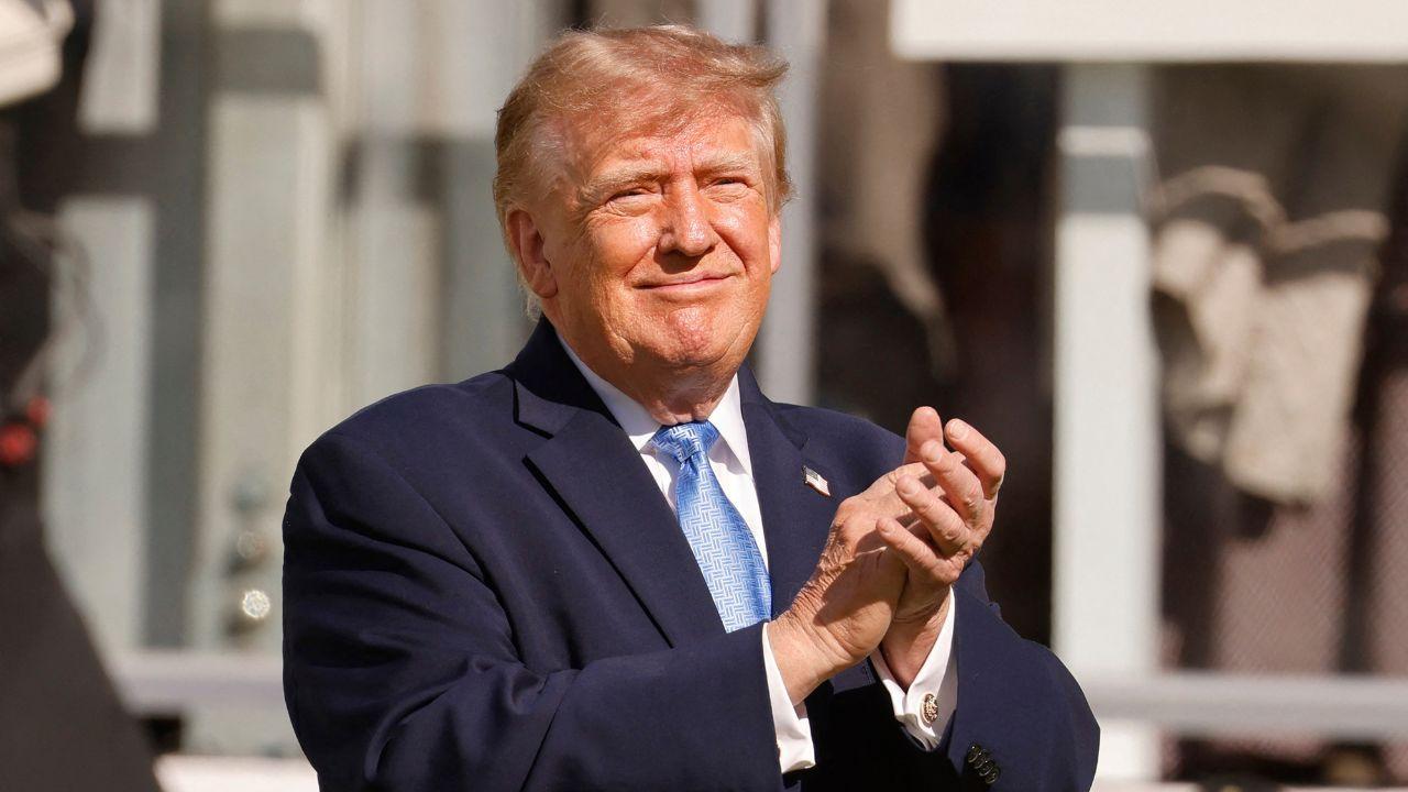 Image of Donald Trump received cheers and chants from supporters inside the tournament.