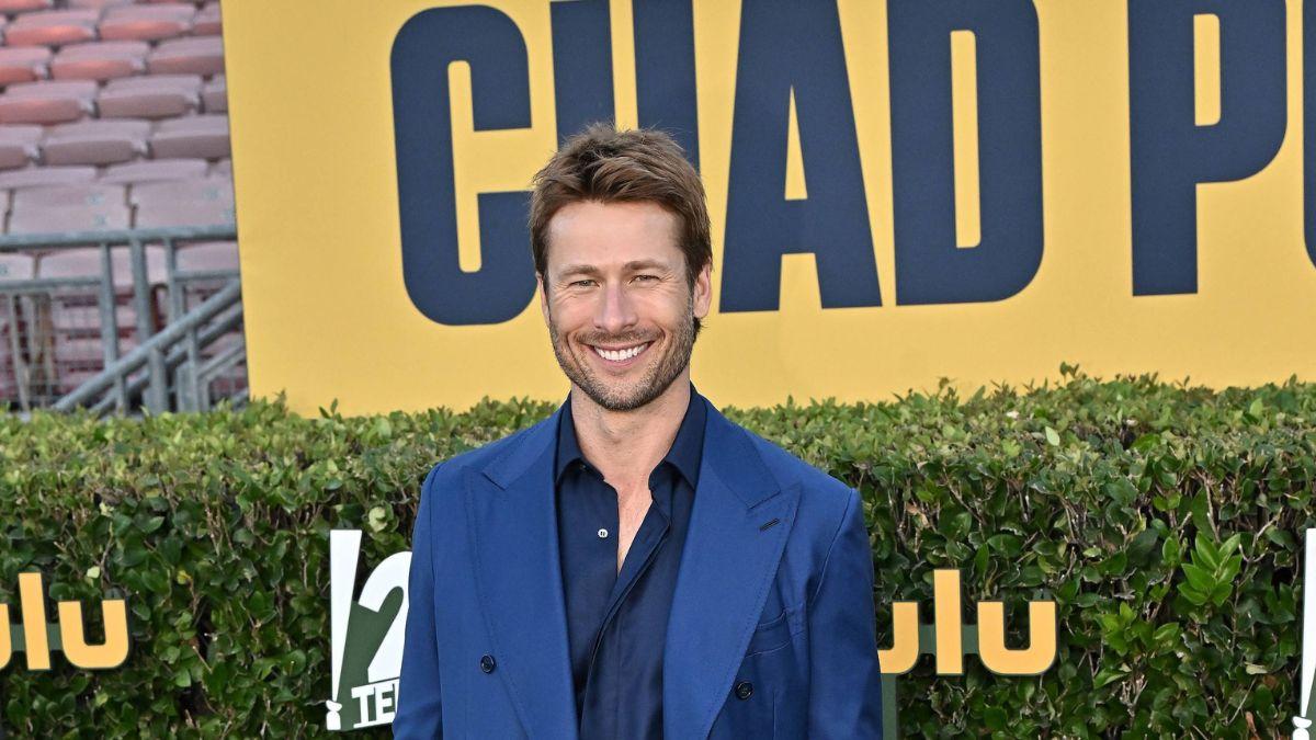 Image of Glen Powell is shown wielding a shotgun in his new movie.