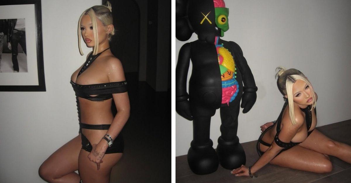 image of The rapper posed confidently in a black outfit with styled hair and makeup.