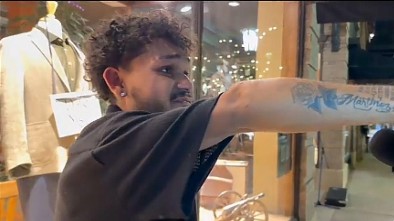 Image of In the clip shared on TikTok, a person in a black shirt was seen running up to two people having a chit-chat on a social media streaming on-the-street channel, interrupting them.