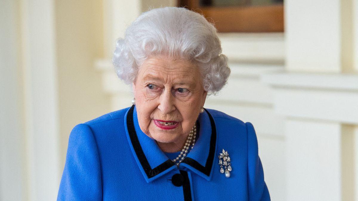 image of Queen Elizabeth snapped when someone walked in front of her.