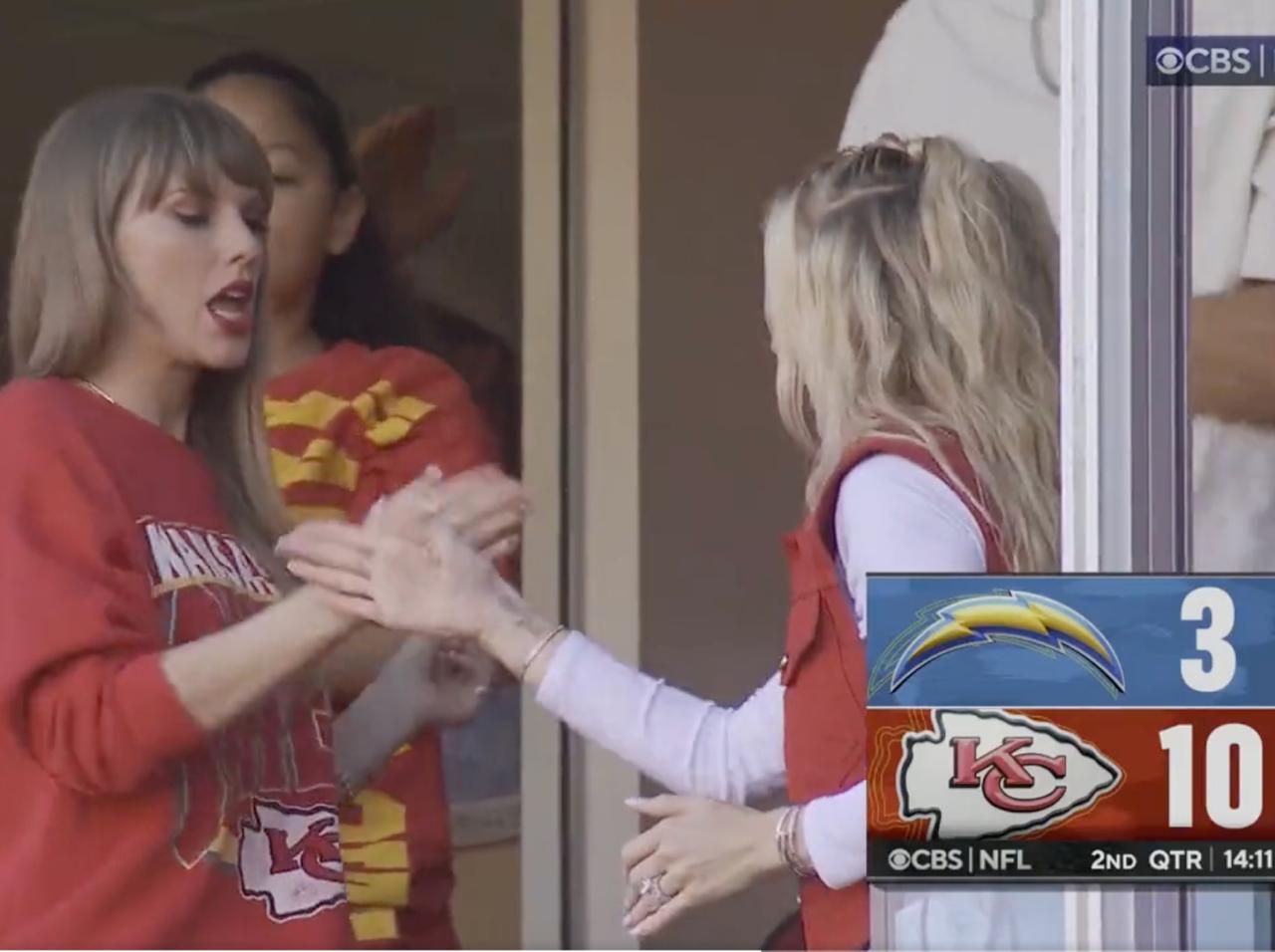 Taylor Swift & Travis Kelce Hold Hands While Leaving Chiefs Game