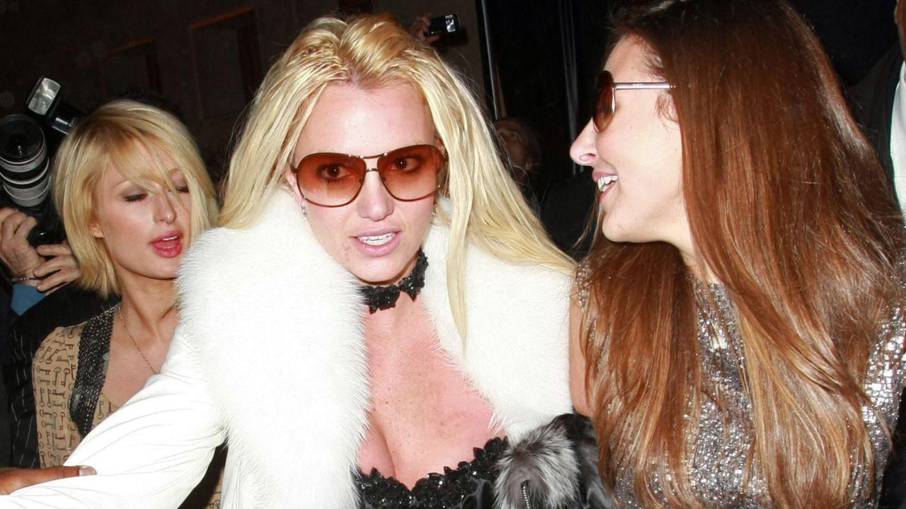 Photo of Paris Hilton explained that she and Britney Spears bonded over the 'shared trauma' they experienced as a women in the early 2000s.