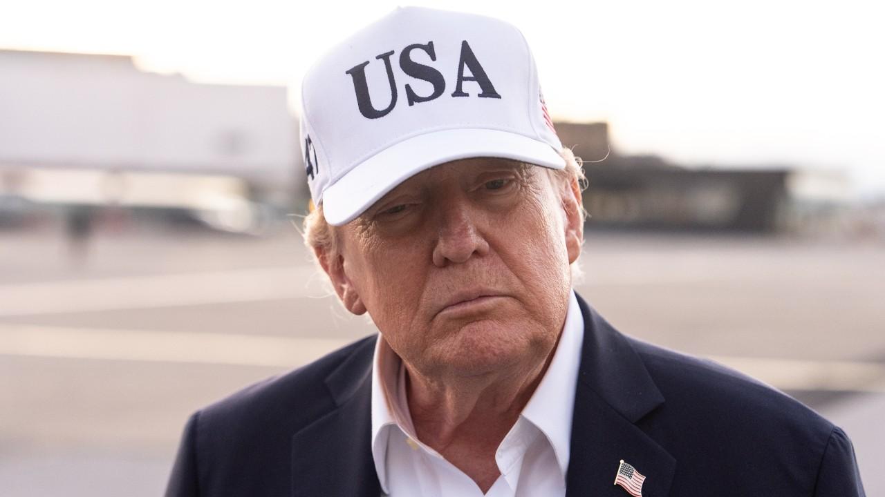 Image of Donald Trump sported a white 'USA' cap as he prepared to leave Ireland following his two-day visit.