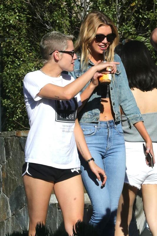 Stella Maxwell whispers sweet things into Kristen Stewart&#8217;s ears