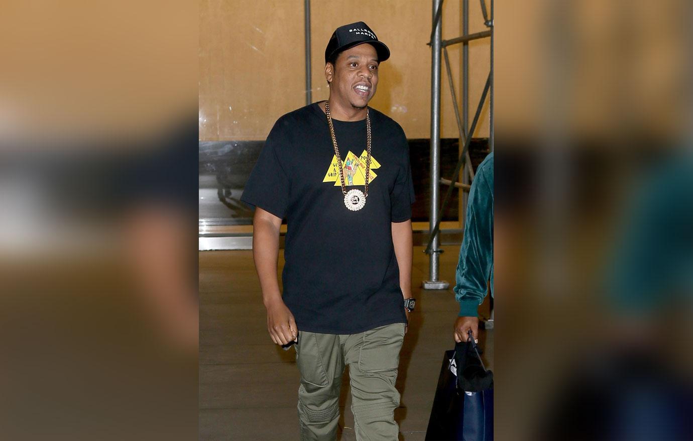 Jay Z is all smiles while leaving his office in NYC