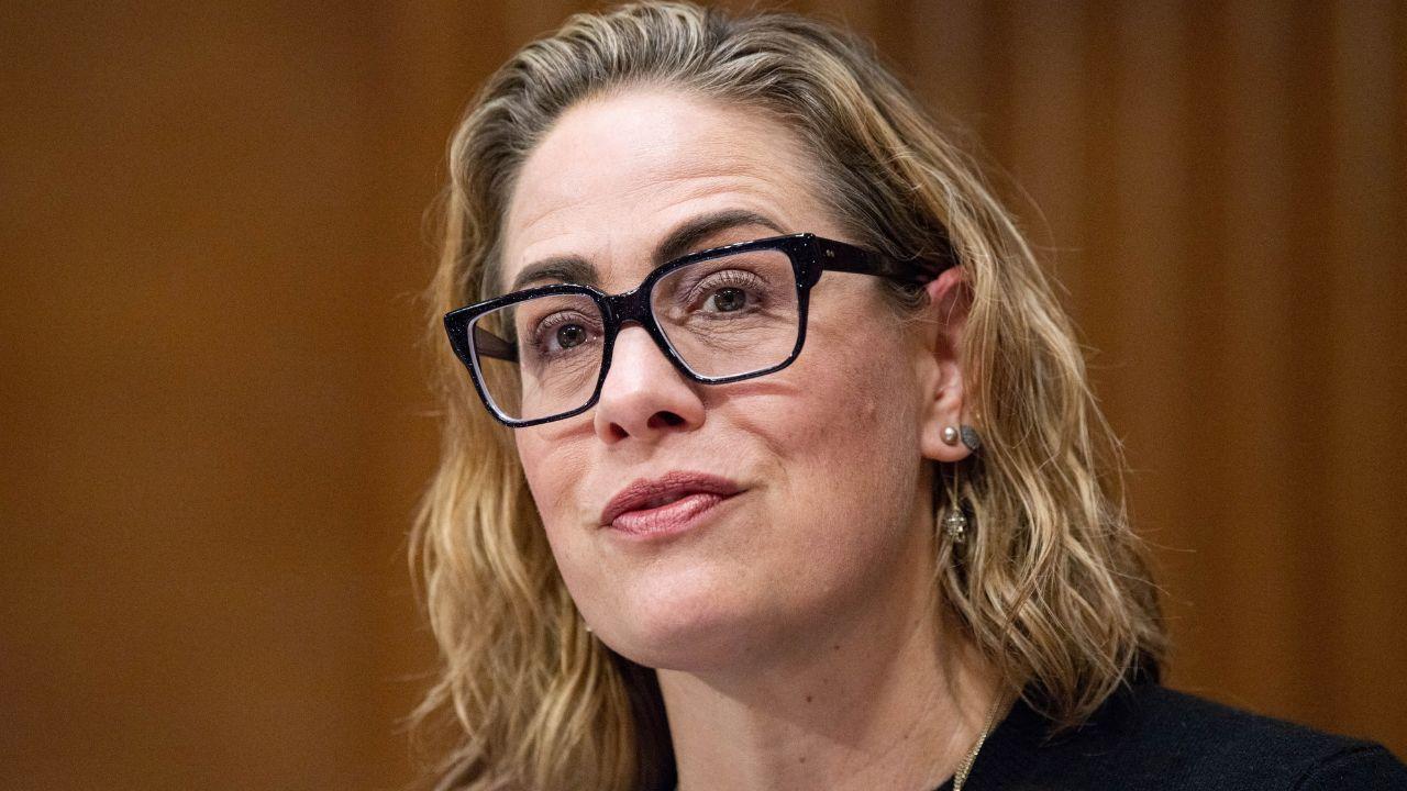 Image of Kyrsten Sinema also accused Matthew Ammel of destroying numerous expensive bottles of alcohol.
