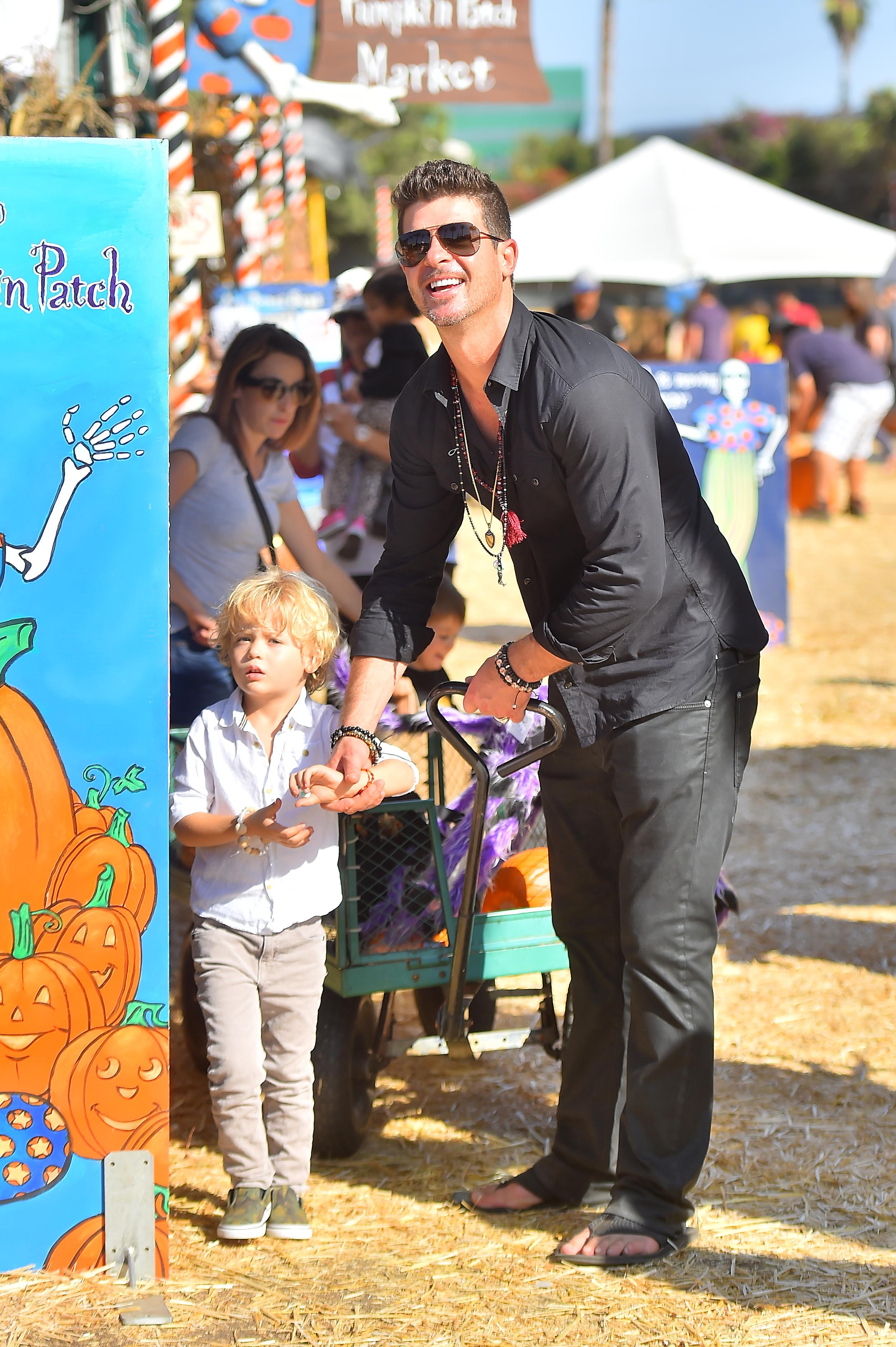 Robin Thicke takes his son Julian to a pumpkin patch in Beverly Hills