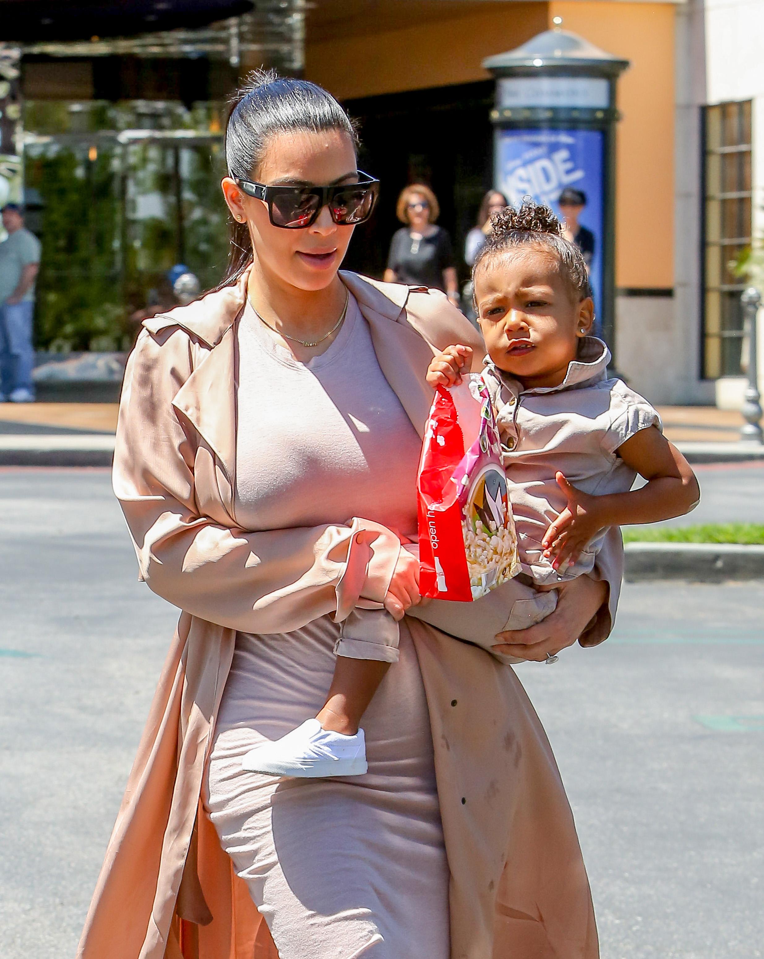 Kim Kardashian and Kanye West take their baby North West to the movies in Calabasas, CA