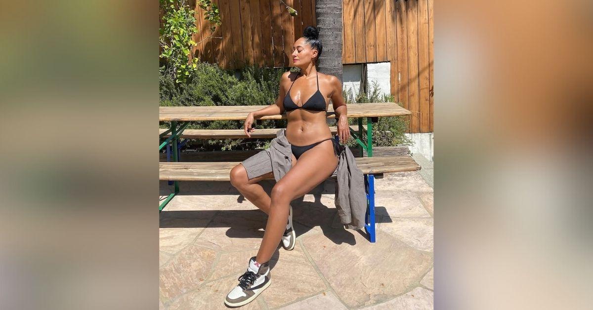 image of Tracee Ellis Ross modeled Air Jordans with a black string bikini in one shot.