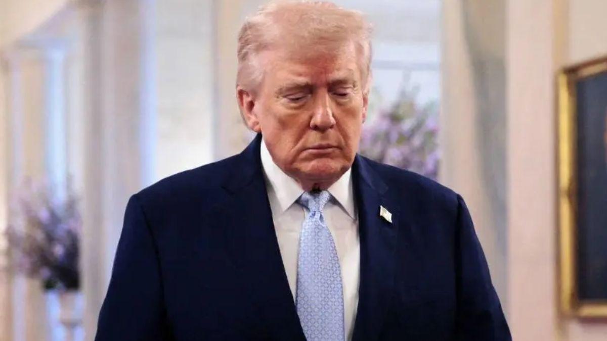 image of Donald Trump takes the stairs very slowly.