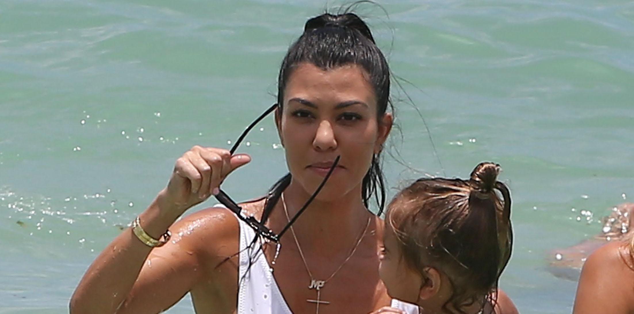 Hot mama Kourtney Kardashian hits the beach