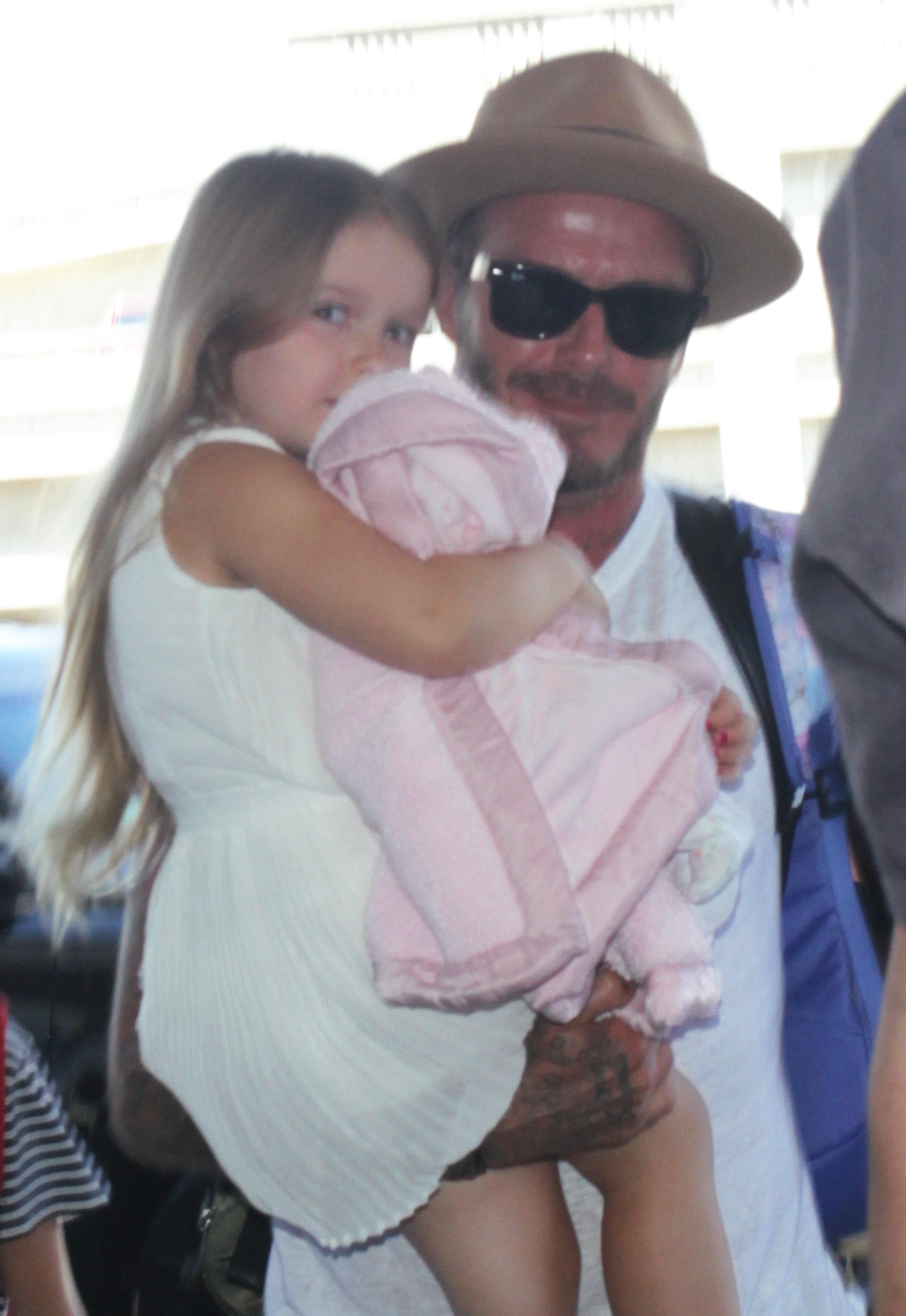 David and Victoria Beckham and family seen at LAX airport