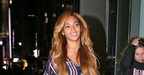Beyonce out and about in NYC wearing a tartan top and leather skirt