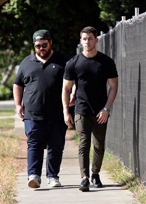 EXCLUSIVE: Nick Jonas looking ripped in a black t shirt