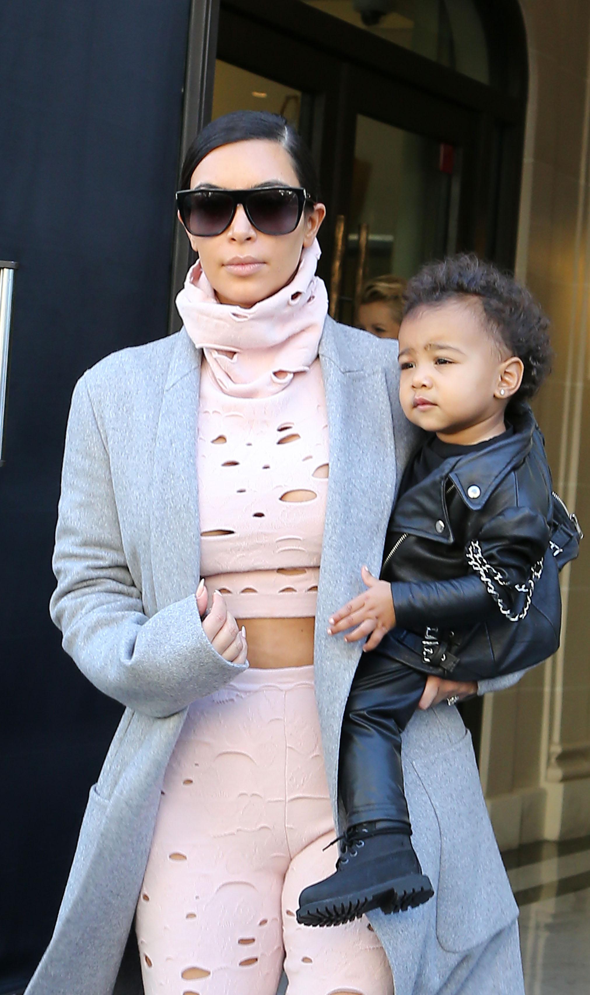 Kim Kardashian leaving her hotel with her daughter North West in Paris