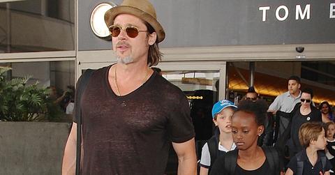 Brad Pitt and Angelina Jolie arriving on a flight at LAX with their children