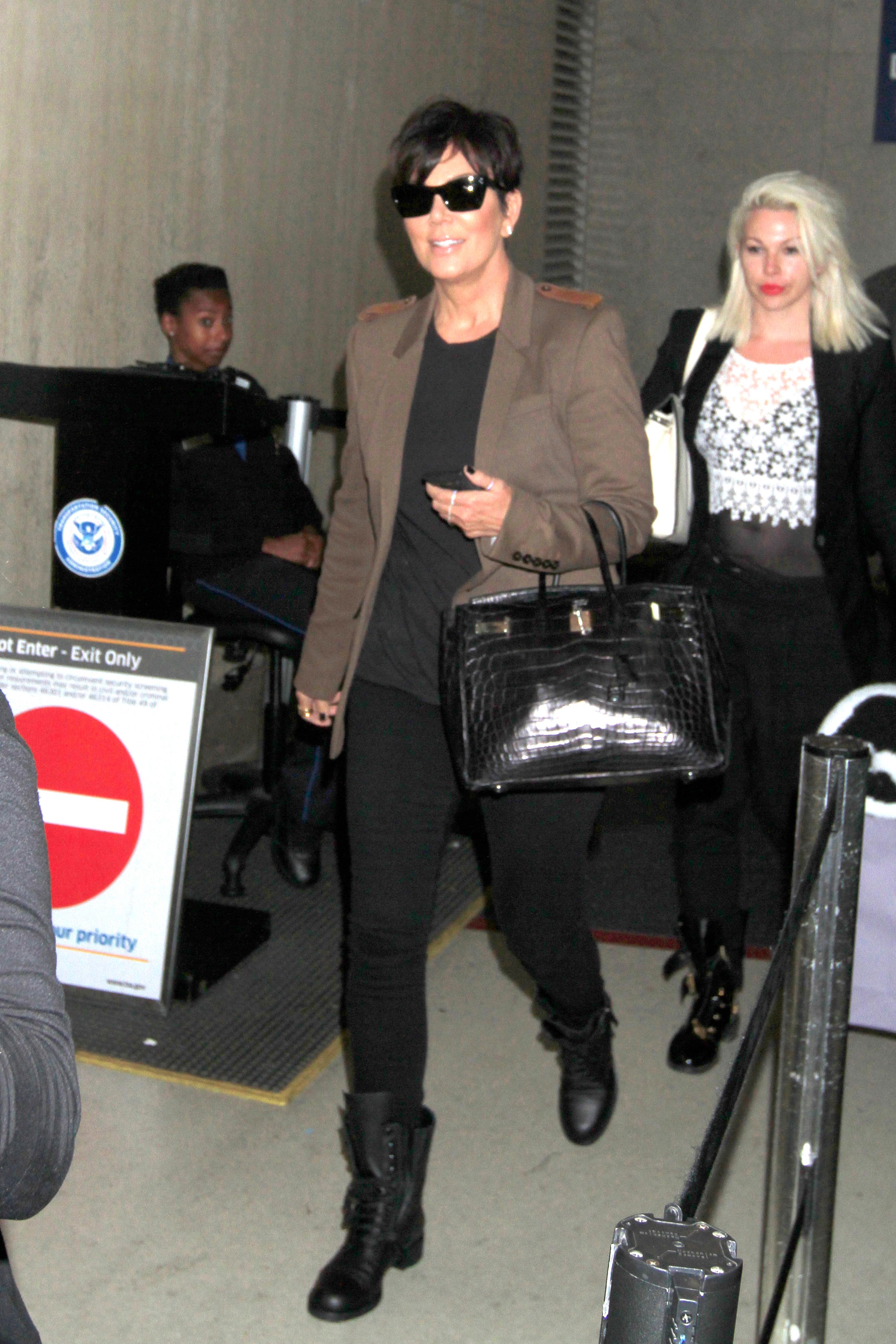 Kris Jenner is seen strolling through LAX in the midst of reports her daughter, Khloe Kardashian is getting a divorce