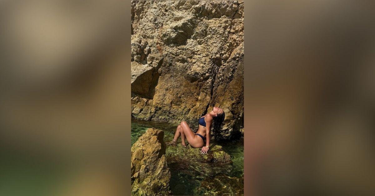 image of The influencer posed in a black bikini.
