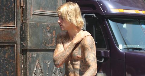 Justin bieber bares chest tattoos shirtless in NYC main
