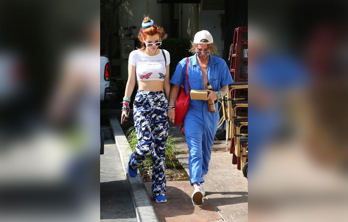 Bella Thorne Mod Sun Holding Hands