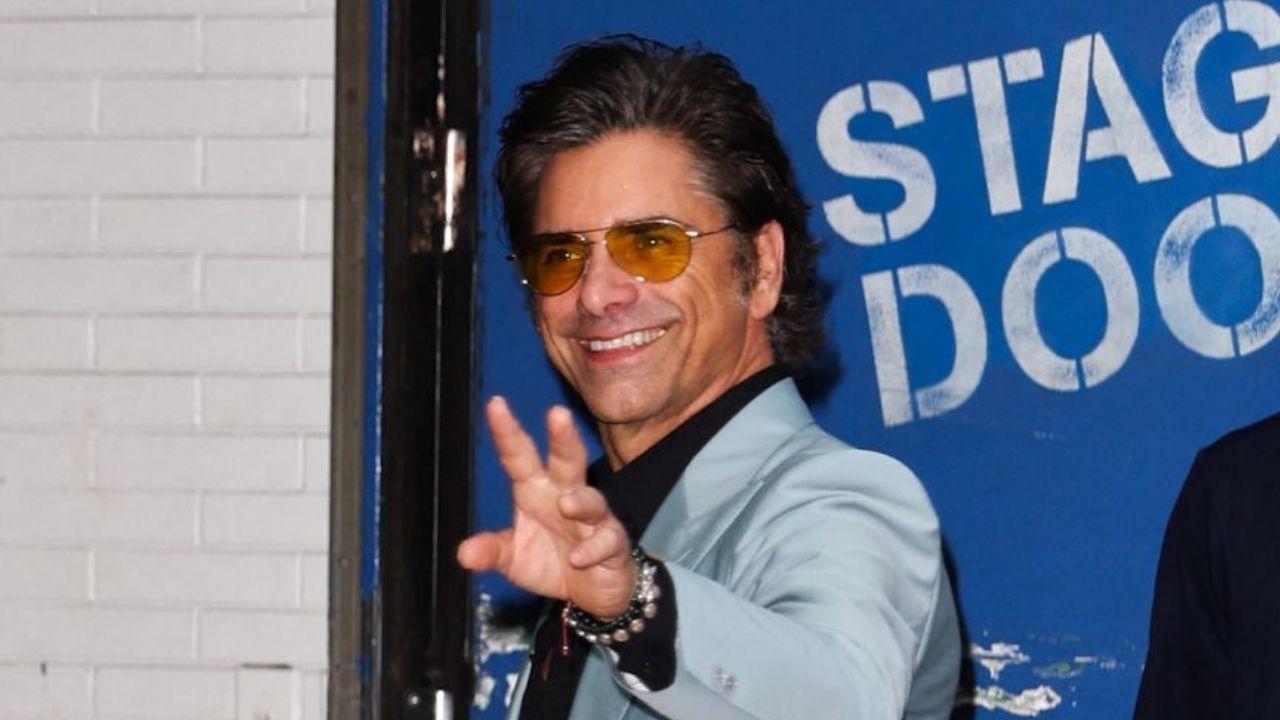 image of John Stamos marked his 62nd birthday with a rooftop shower photo in New York City and a message about gratitude, family and friendship.