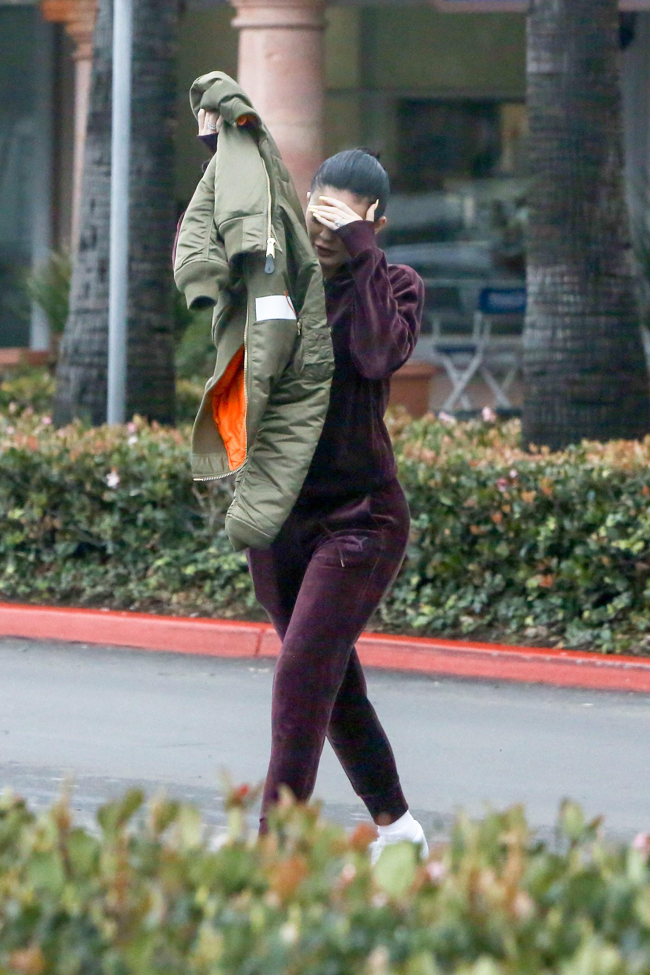 *EXCLUSIVE* Kylie Jenner hides her face after losing legal battle against Kylie Minogue