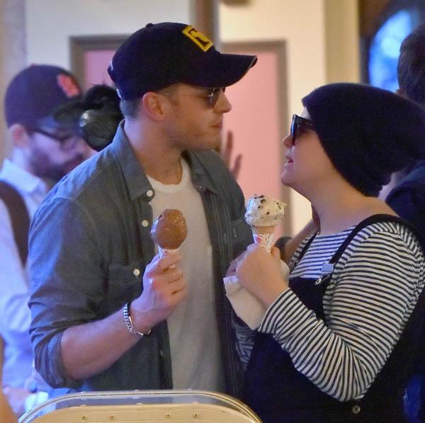 EXCLUSIVE: Pregnant Ginnifer Goodwin and her husband Josh Dallas share some sweet PDA at Disneyland