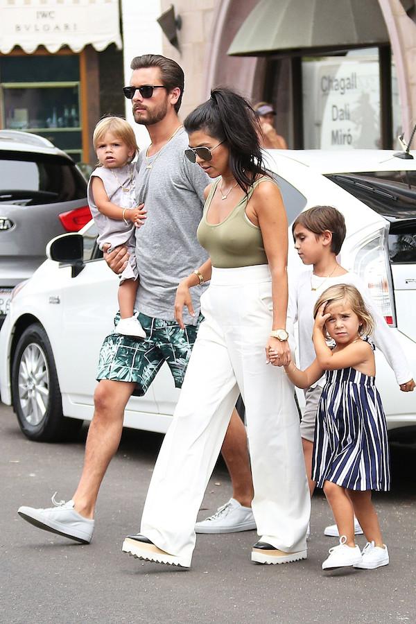 Kourtney and Scott hold hands as they show a United Front in San Diego