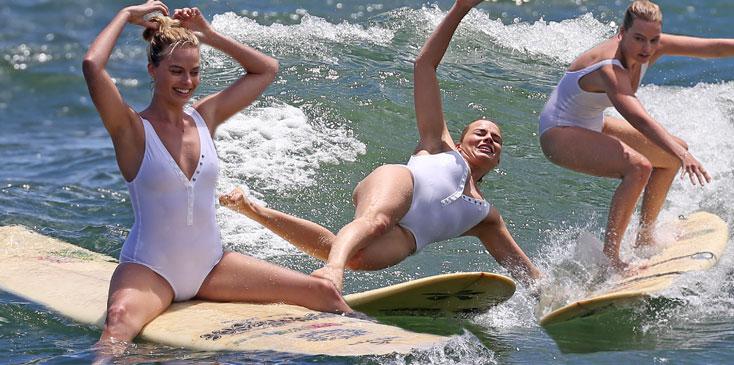 suicide squad margot robbie wipes out surfing sexy white one piece bathing suit