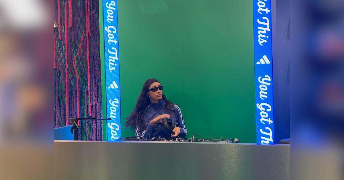 image of The singer-songwriter wore low-rise khaki-style pants, a black cropped top and a dark jacket while showing off her modern home.